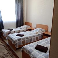 Кровать в общем номере с видом на город, Отель Эмдер, Нягань