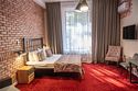 Двухместный номер высшей категории Джуниор сюит двуспальная кровать, Отель История, Новгород